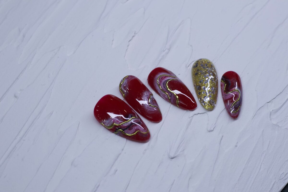 Red & gold nail design at Cathy Nail House